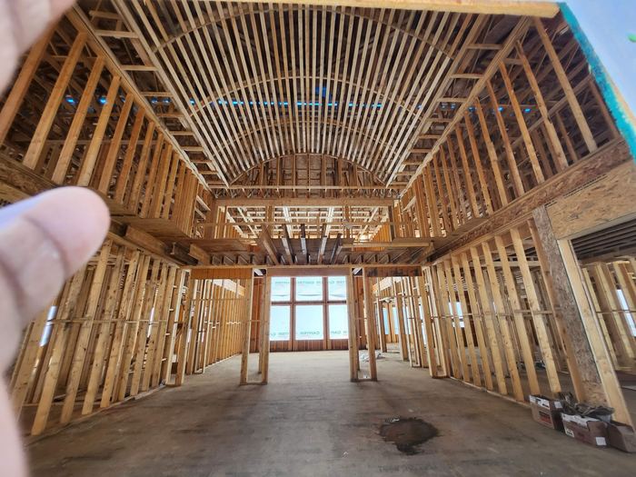 Framed interior showing floor and ceiling structure