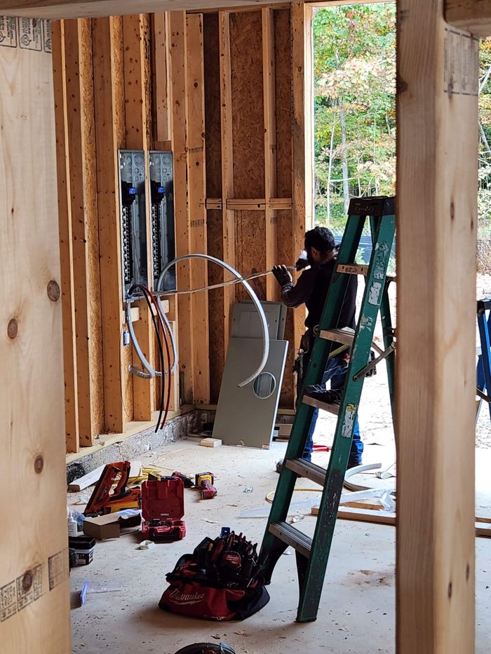 Electrical rough-in and panel work within framed walls