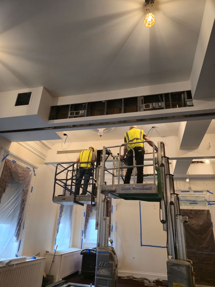 Ceiling and high-level works in progress from an access lift